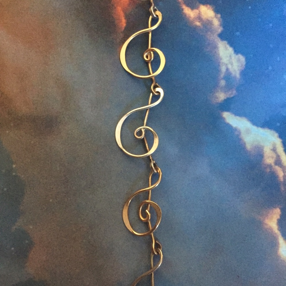 Treble cleft gold and silver bracelet